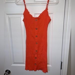 peachy skin tight dress with brown buttons